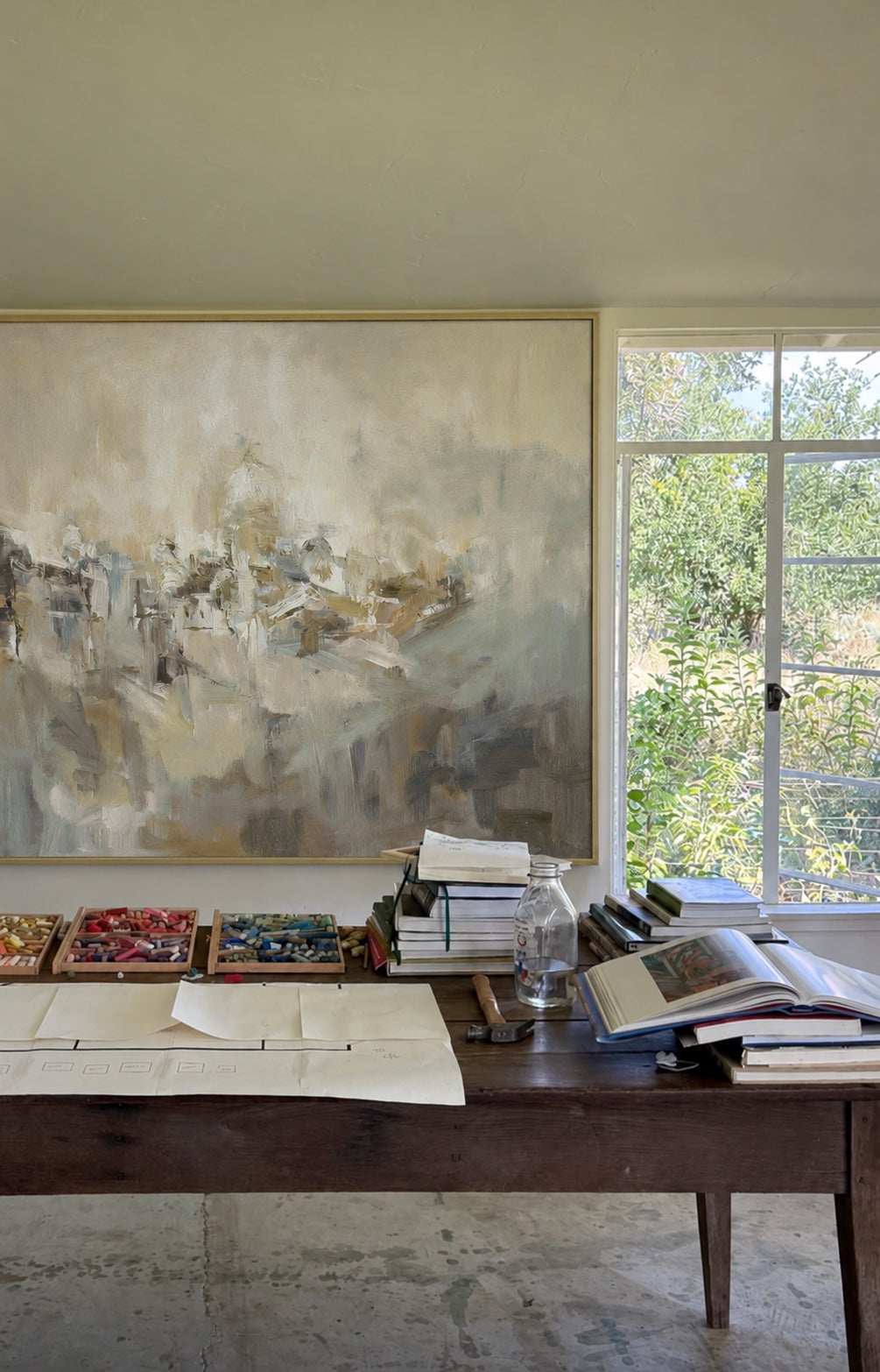 Abstract Village above a worktable beside a window