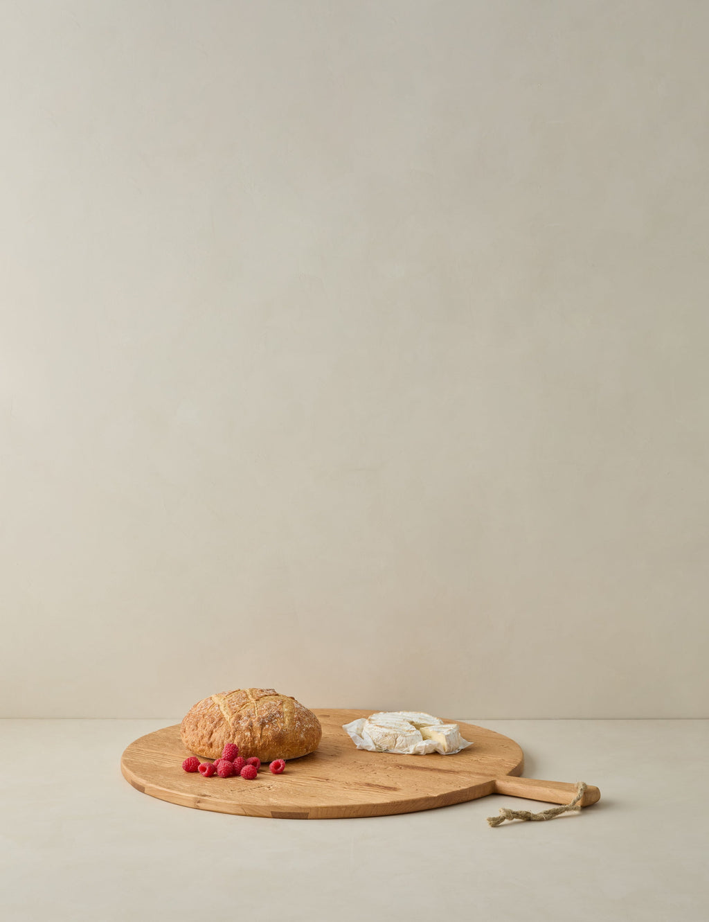Lulu and Georgia - Handcrafted Round Pine Serving Board by etúHOME