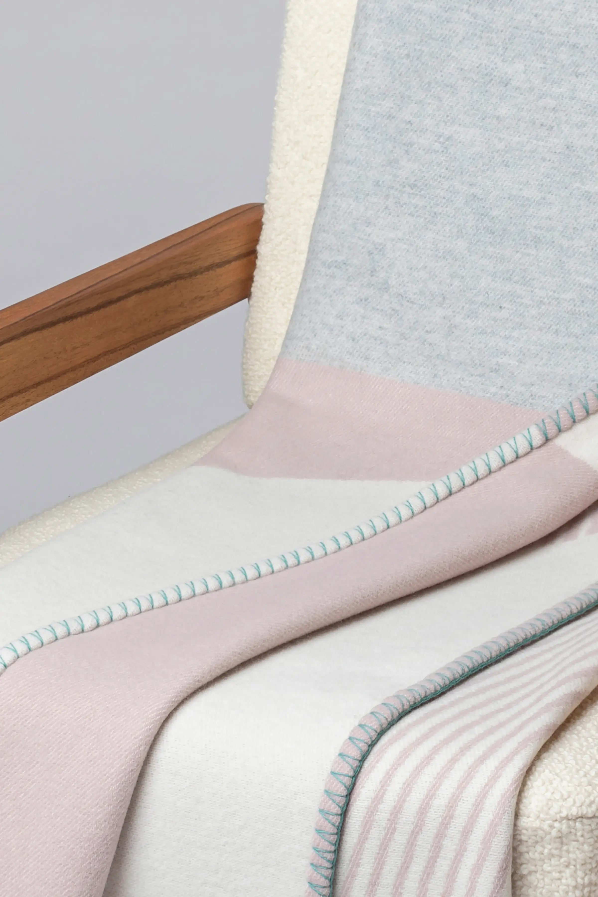 Johnstons of Elgin - Blanket Stitched Geometric Throw in Playful Pastel