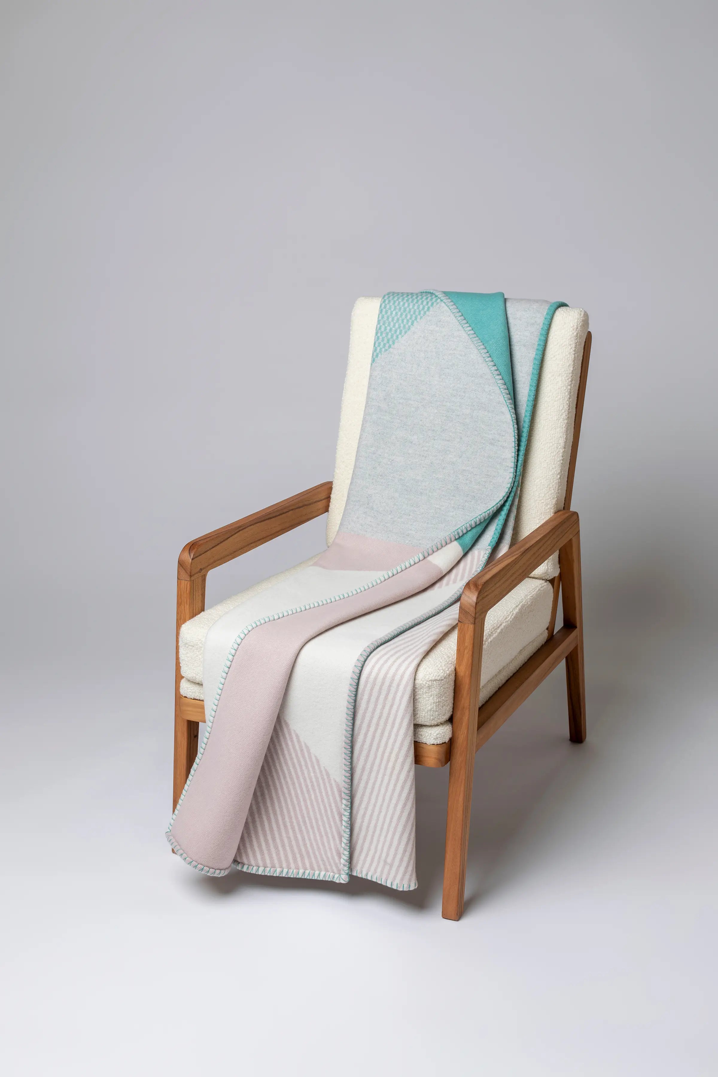 Johnstons of Elgin - Blanket Stitched Geometric Throw in Playful Pastel
