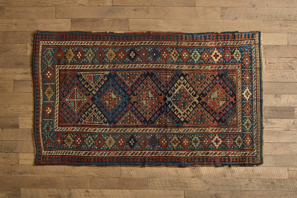 Nicky Kehoe - Blue & Red Kazak Rug 4'8 X 8'2