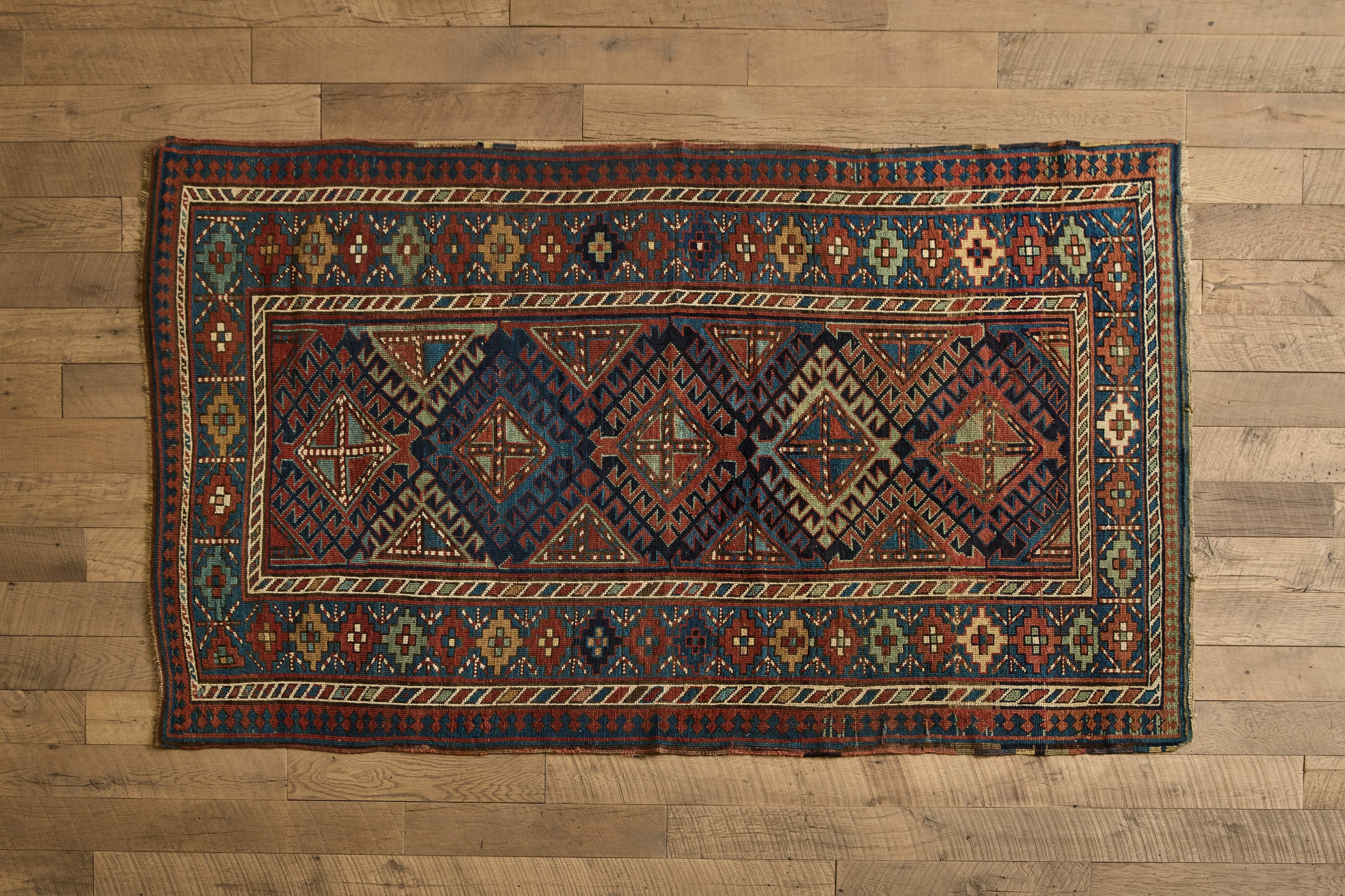 Nicky Kehoe - Blue & Red Kazak Rug 4'8 X 8'2