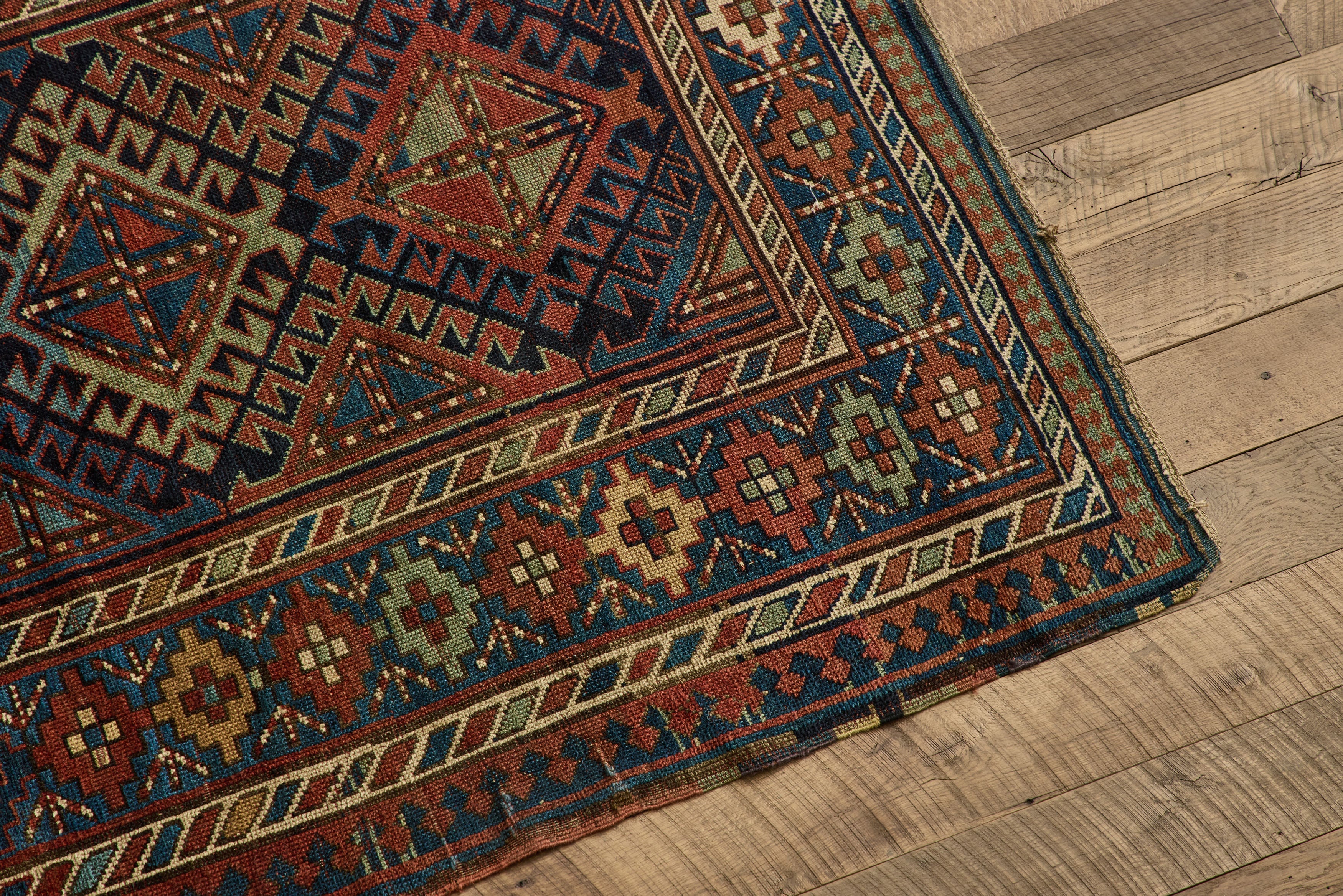 Nicky Kehoe - Blue & Red Kazak Rug 4'8 X 8'2