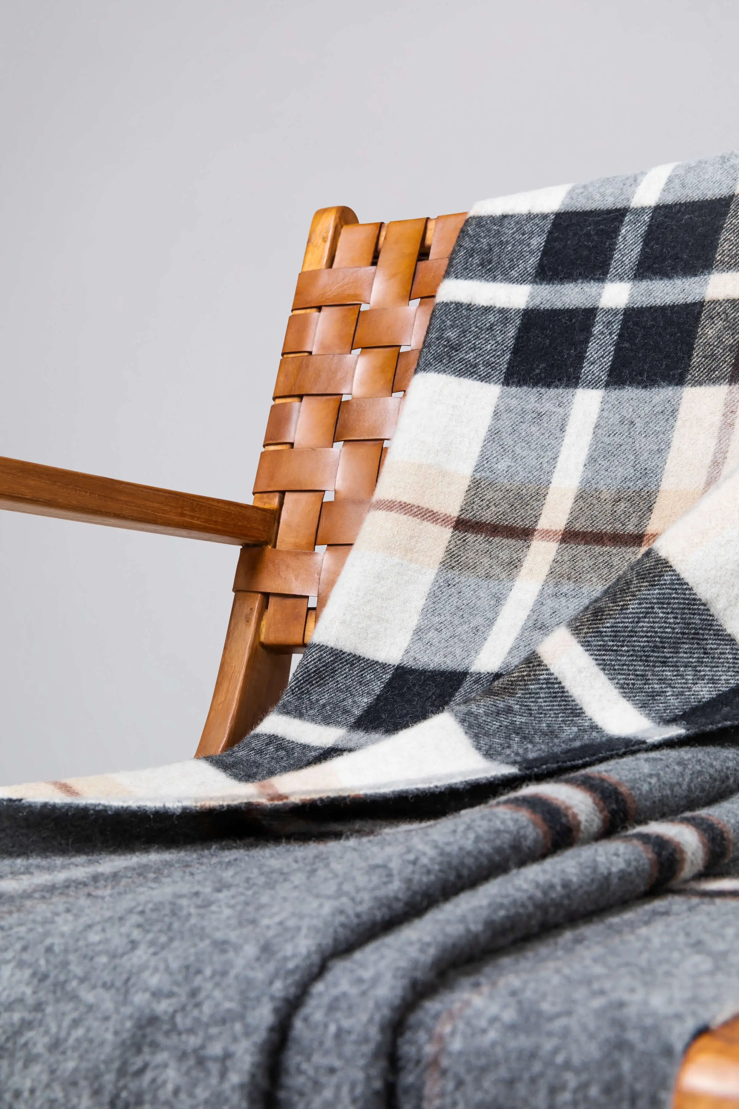 Johnstons of Elgin - Double Face Lambswool Throw in Black & Brown Plaid