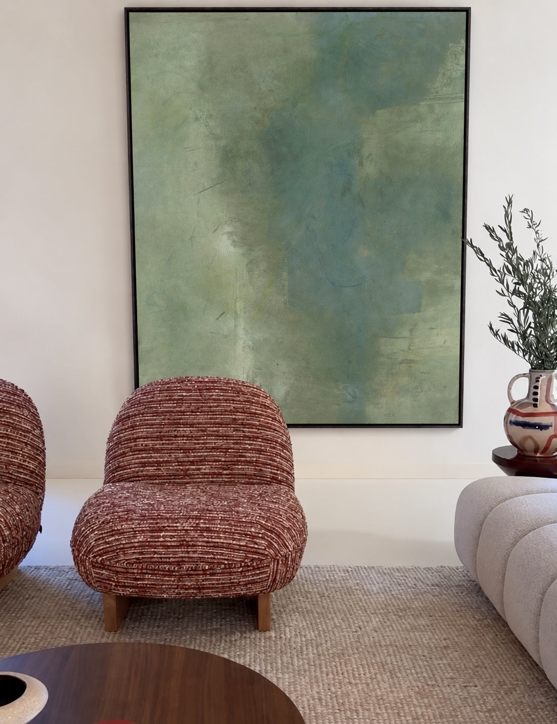 Study of Green behind rust-red chairs