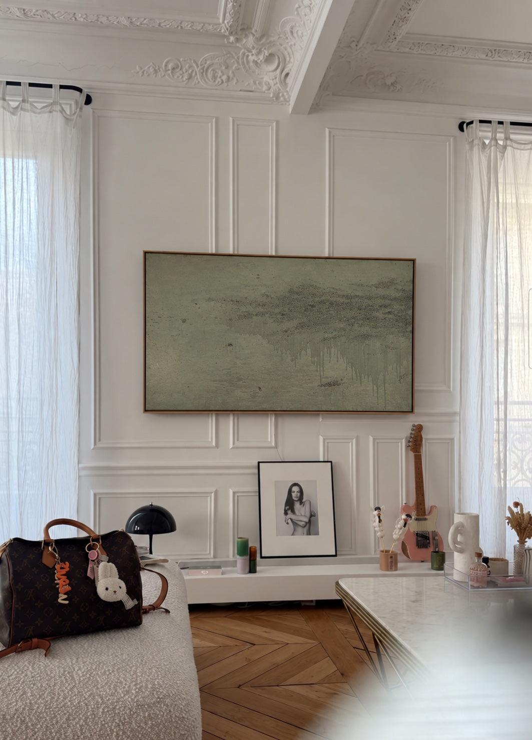 Knowledge of the Stream between windows above a smaller portrait